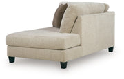 Ashley Furniture Steelwater Retreat sectional with chaise, featuring plush upholstery and modern design, shown from an angled view.