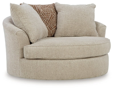Ashley Furniture Steelwater Retreat oversized swivel accent chair with plush upholstery and wooden legs, shown from an angle.
