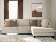 Ashley Furniture Steelwater Retreat sectional with chaise, showcasing plush fabric upholstery and modern design in a cozy living room setting.