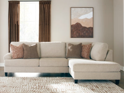 Ashley Furniture Steelwater Retreat sectional with chaise, showcasing plush fabric upholstery and modern design in a cozy living room setting.