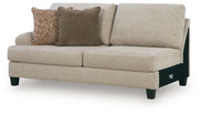 Ashley Furniture Steelwater Retreat sectional with chaise, featuring plush cushions and modern design in a stylish living room setting.