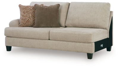 Ashley Furniture Steelwater Retreat sectional with chaise, featuring plush cushions and modern design in a stylish living room setting.