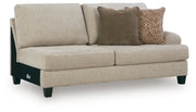 Ashley Furniture Steelwater Retreat sectional with chaise, showing plush upholstery and modern design from an angled view.