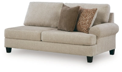 Ashley Furniture Steelwater Retreat sectional with chaise showing plush fabric upholstery and modern design from an angled view.