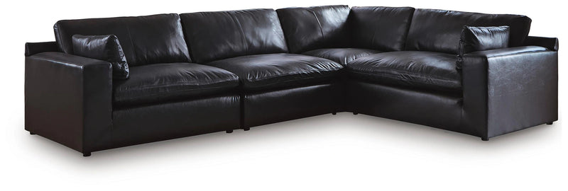 Ashley Furniture Emilia sectional sofa in a neutral fabric with spacious seating and plush cushions