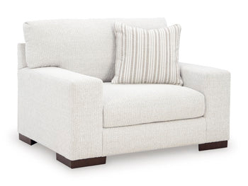 Ashley Furniture Hartside oversized chair with plush fabric and wide armrests, shown from an angled side view.