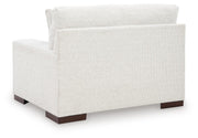 Ashley Furniture Hartside oversized chair with plush fabric and wide armrests, shown from the back in a modern living room setting.