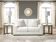Ashley Furniture Hartside Loveseat with plush cushions and neutral fabric upholstery, ideal for cozy living room seating.