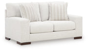 Ashley Furniture Hartside Loveseat with plush fabric upholstery and cushioned armrests, shown from an angled view.