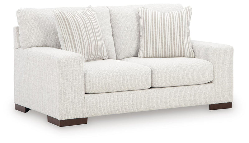Ashley Furniture Hartside Loveseat with plush fabric upholstery and cushioned armrests, shown from an angled view.