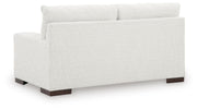 Ashley Furniture Hartside Loveseat with plush fabric upholstery and padded armrests, shown from the back.