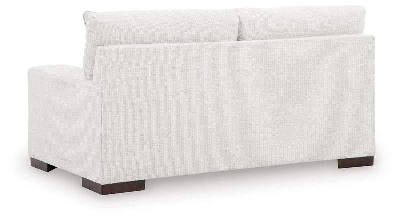 Ashley Furniture Hartside Loveseat with plush fabric upholstery and padded armrests, shown from the back.