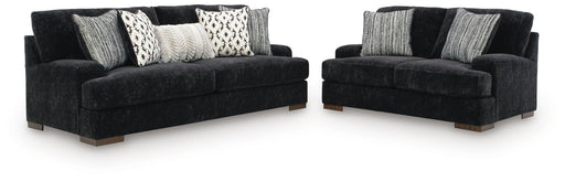 Ashley Furniture Whitmore Manor living room set with sofa and loveseat, featuring plush cushions and elegant upholstery.