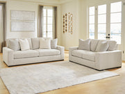 Ashley Furniture Conlee-Pike living room set featuring a sofa and armchair with neutral fabric upholstery and modern design.