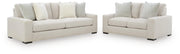Ashley Furniture Conlee-Pike living room set with sofa and armchair, featuring plush cushions and neutral upholstery.
