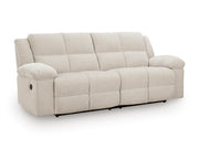 Ashley Furniture Orlen reclining sofa in a stylish fabric, shown from an angled view with closed recliners and plush cushioning.