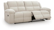 Ashley Furniture Orlen reclining sofa, shown from an angle with open recliner, featuring plush cushions and contemporary design.