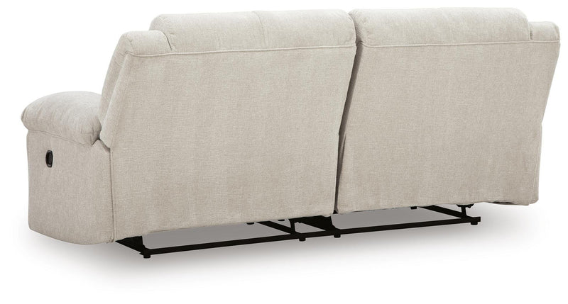 Ashley Furniture Orlen reclining sofa with plush cushions and reclining features, shown from the back view.