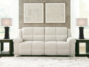 Ashley Furniture Orlen Reclining Sofa in neutral fabric, showing plush cushions and modern design with multiple reclining seats.