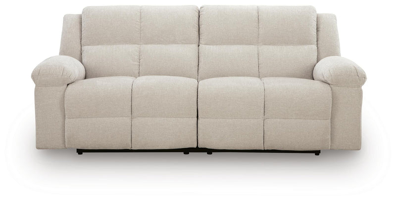 Ashley Furniture Orlen reclining sofa shown from head-on view, featuring plush fabric and padded armrests.