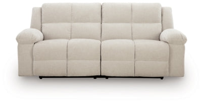 Ashley Furniture Orlen reclining sofa shown from head-on view, featuring plush fabric and padded armrests.