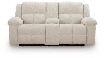 Ashley Furniture Orlen reclining loveseat with center console, showing plush fabric, padded armrests, and built-in cup holders.