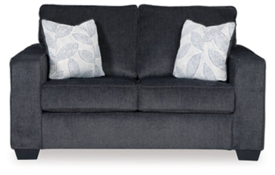 Ashley Furniture Altari loveseat with plush fabric, shown in a cozy living room setting, featuring cushioned armrests and a modern design.