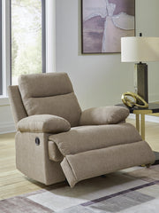 Open Ashley Furniture side-swipe recliner showing plush cushioning and wooden base in a modern living room setting.