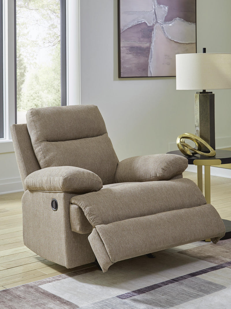 Open Ashley Furniture side-swipe recliner showing plush cushioning and wooden base in a modern living room setting.