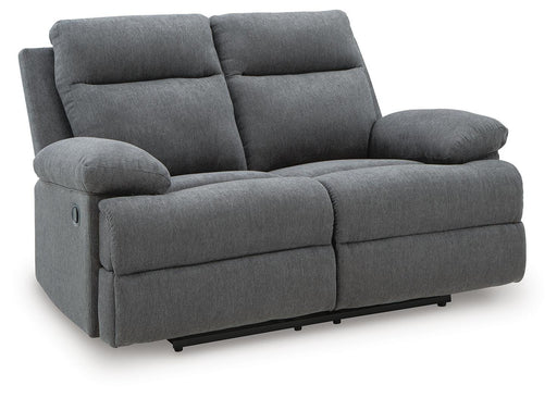 Ashley Furniture Side-Swipe Reclining Loveseat showing plush fabric, padded armrests, and reclining mechanism from an angled view.