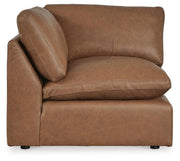 Ashley Furniture Emilia sectional sofa in a neutral fabric with chaise lounge and plush cushions