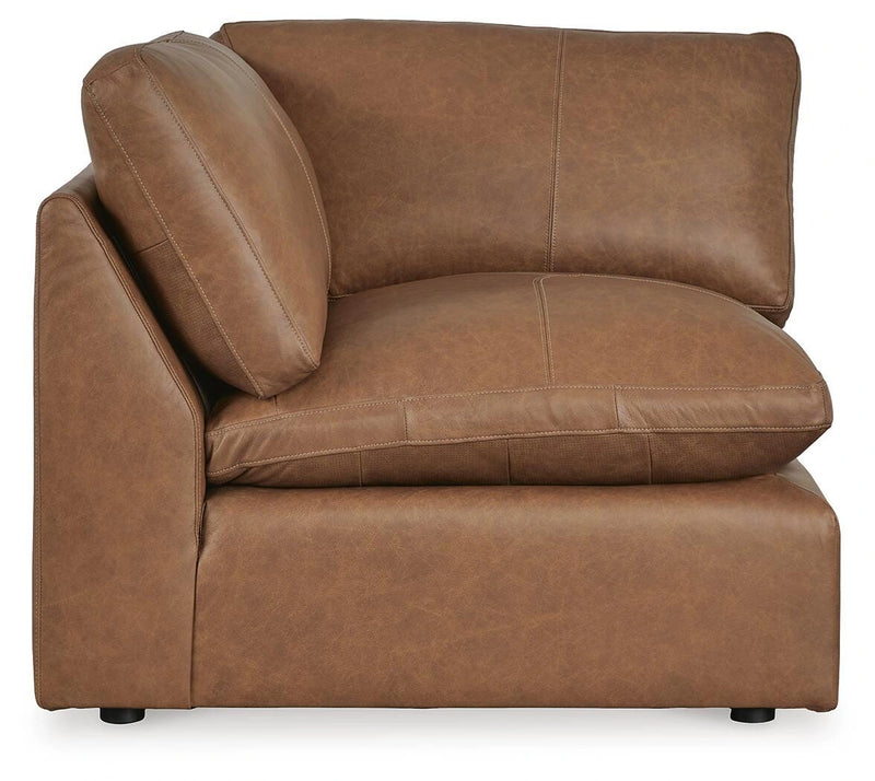 Ashley Furniture Emilia sectional sofa in a neutral fabric with chaise lounge and plush cushions