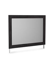 Ashley Furniture Belachime bedroom mirror showing a large, elegant rectangular mirror with a wooden frame in a bedroom setting.