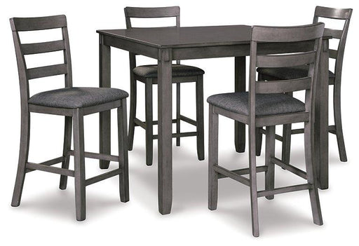 Ashley Furniture counter height dining table with four matching bar stools, featuring a modern wooden design and sturdy metal legs.