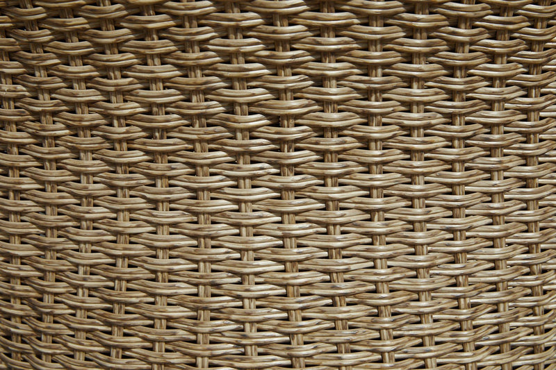 Set of two Ashley Furniture Amaris outdoor dining chairs with woven seats and armrests, designed for patio or garden use.
