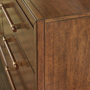 Ashley Furniture Lyncott dresser with matching mirror, wooden finish, and modern design, shown in a well-lit bedroom setting.