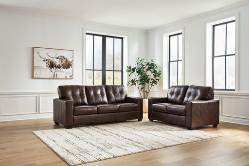Ashley Furniture Santorine living room set with sofa and armchair featuring neutral upholstery and modern design accents.