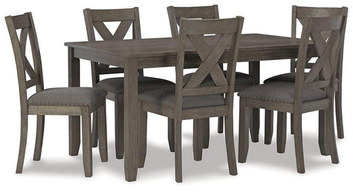 Ashley Furniture Caitbrook dining table with six matching chairs, showcasing a wooden dining set for family gatherings.