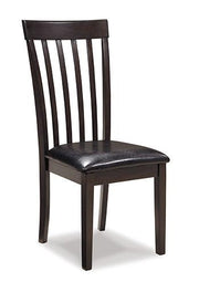 Ashley Furniture Hammis dining chair with upholstered seat and back, wooden legs, in a modern dining room setting.