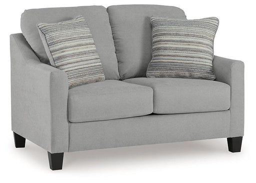 Adlai loveseat by Ashley Furniture featuring soft beige upholstery and plush cushions in a modern living room setting.