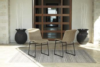 Set of two Ashley Furniture Amaris outdoor dining chairs with metal frames and woven seats for patio or garden use.