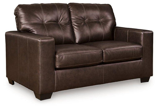 Ashley Furniture Santorine loveseat with plush cushions and wooden legs, showcasing a cozy, modern living room style.