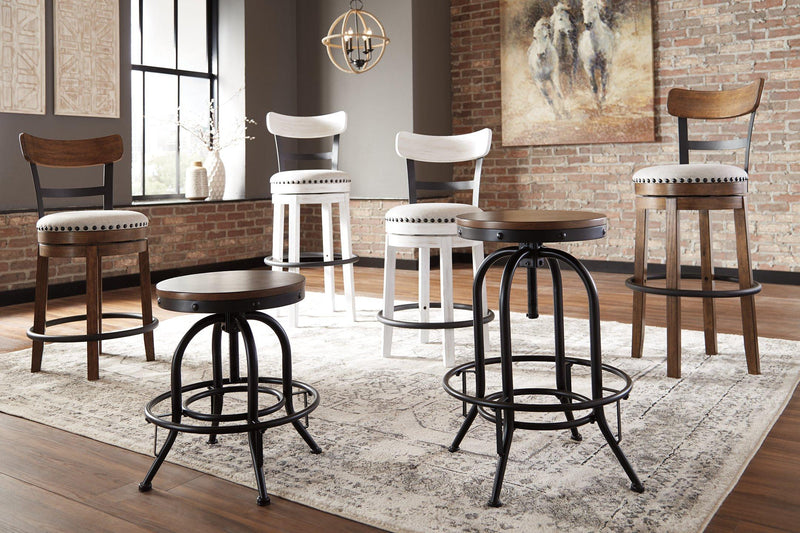 Ashley Furniture Valebeck counter height bar stool with a wooden seat and metal frame, showcasing a modern design.
