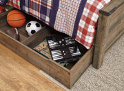 Ashley Furniture Trinell Bed with Storage showing a modern bed frame with built-in storage drawers in a bedroom setting.