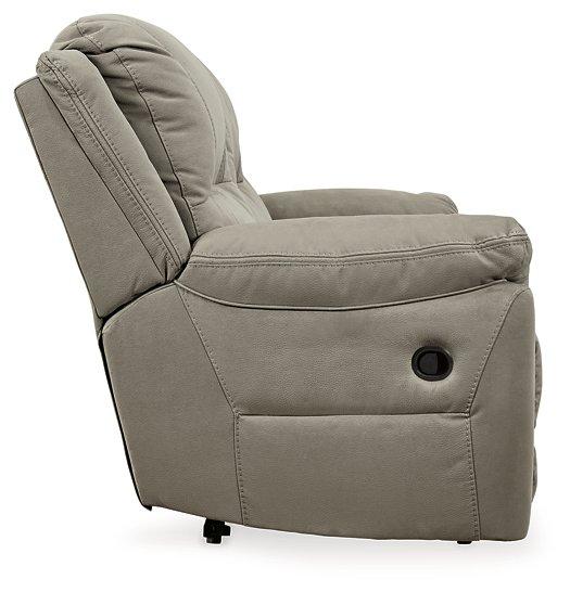 Ashley Furniture Next-Gen Gaucho Reclining Sofa with plush cushions and reclining armrests, shown in a modern living room setting.