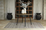 Outdoor dining table by Ashley Furniture, featuring a spacious wooden surface ideal for outdoor meals and gatherings.