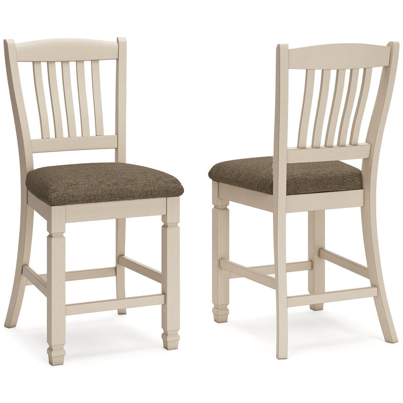 Ashley Furniture Bolanburg counter height bar stool with wooden legs and cushioned seat, shown in a modern kitchen setting.