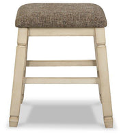 Ashley Furniture Bolanburg counter height bar stool with wooden legs and cushioned seat, ideal for kitchen or bar area.