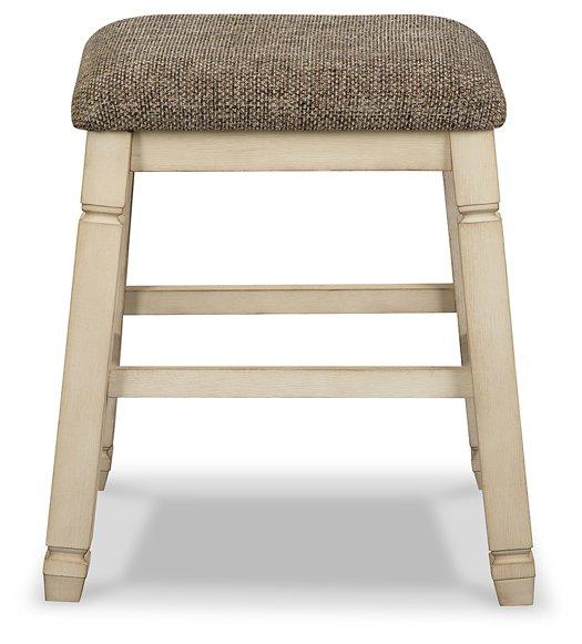Ashley Furniture Bolanburg counter height bar stool with wooden legs and cushioned seat, ideal for kitchen or bar area.
