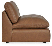 Ashley Furniture Emilia Sectional sofa with plush cushions and modern design, shown in a stylish living room setting.